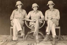 Three men in African campaign uniforms including the helmets